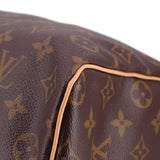 Monogram canvas bag corner with tan leather piping