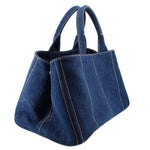 Prada Canapa denim tote bag, angled view with double handles and side panel seams