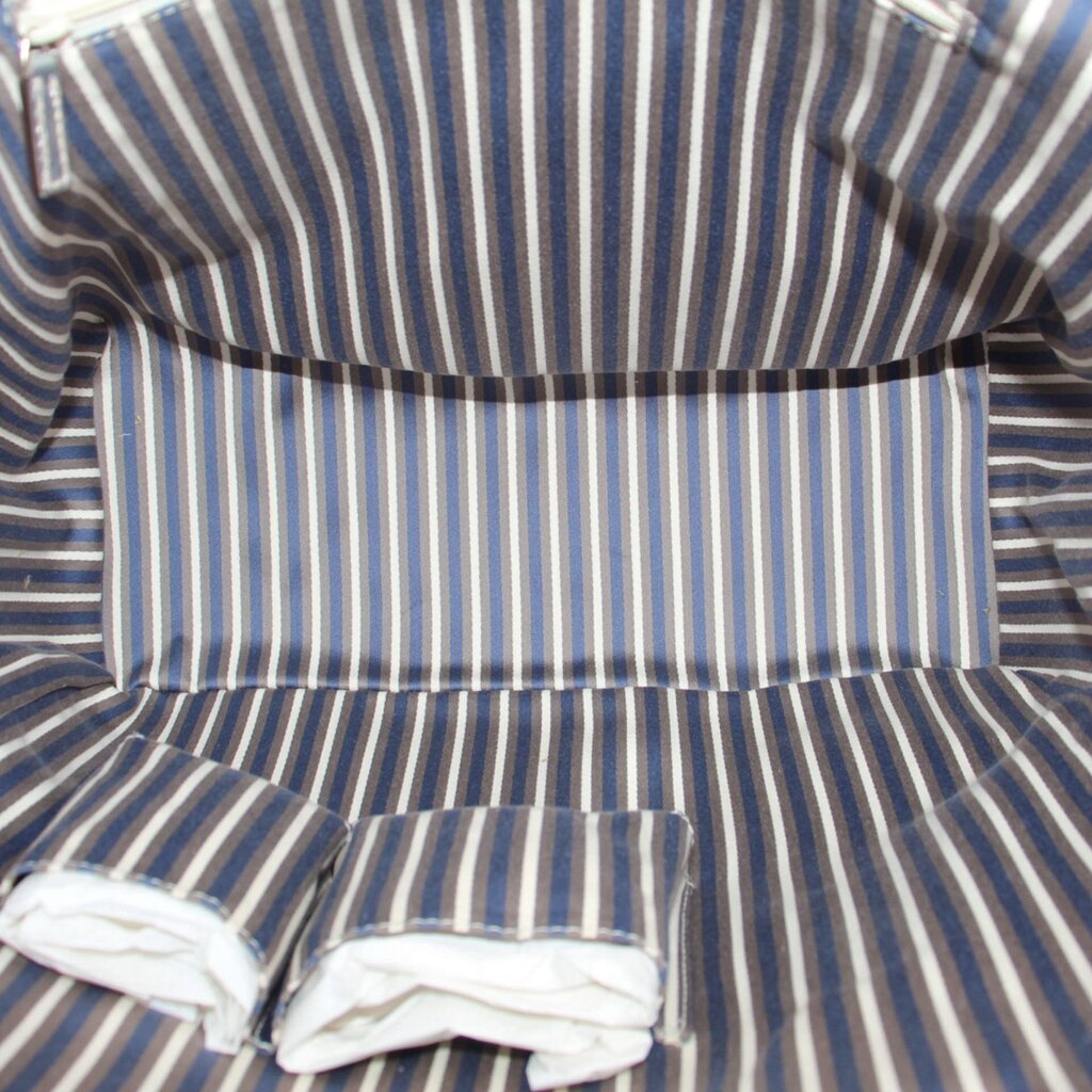 Tote bag interior with blue and white striped fabric lining and stitched seams