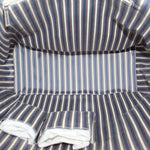 Tote bag interior with blue and white striped fabric lining and stitched seams