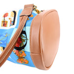 GUCCI vintage drawstring backpack, side view of tan leather trim and blue printed fabric