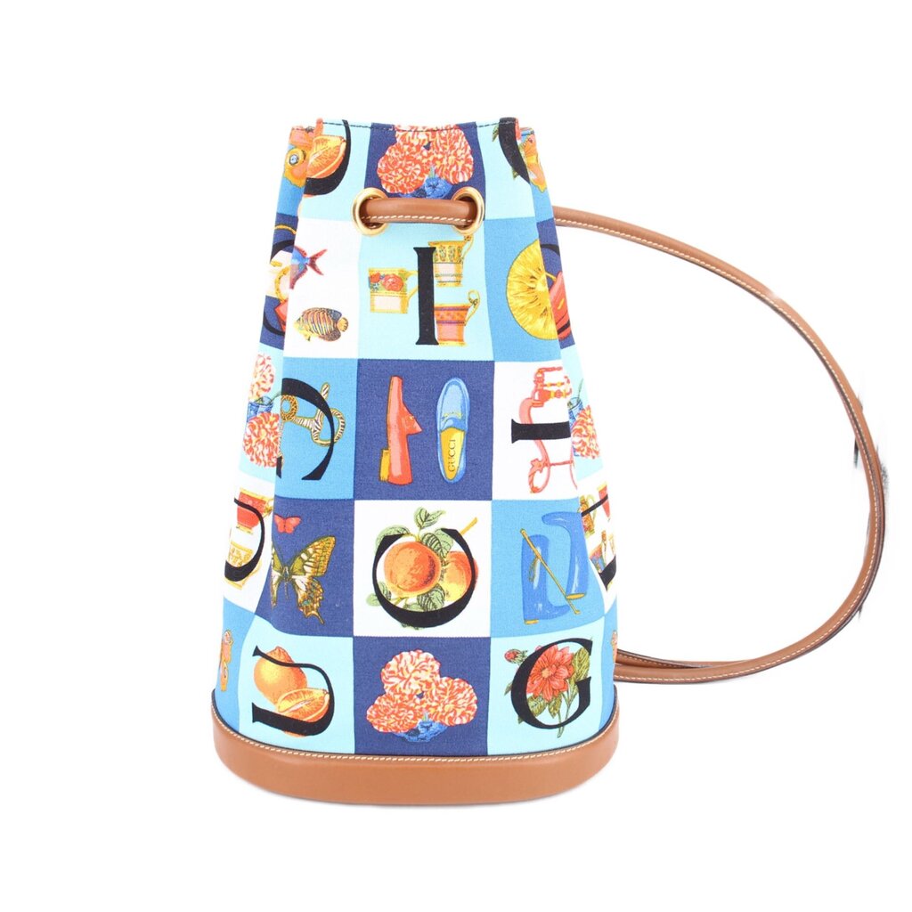 GUCCI vintage drawstring backpack, blue canvas with colorful print, tan leather trim and cords