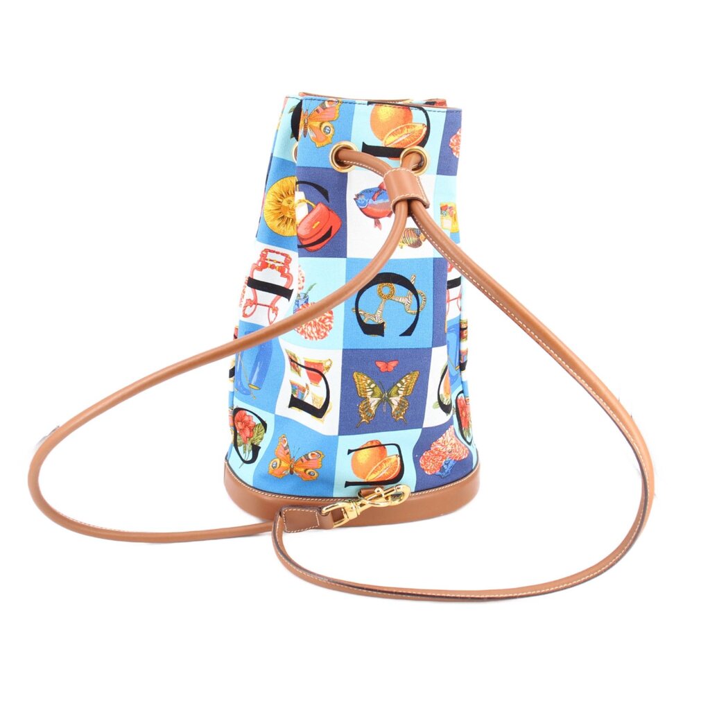 GUCCI vintage drawstring backpack, blue multi-print fabric with tan braided cord and leather base