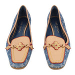 Pair of blue denim monogram loafers with tan trim and gold clover bit accents