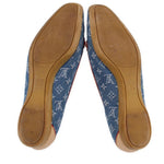 Blue denim monogram loafers showing interior and rubber sole with tan backing