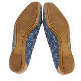 Blue denim monogram loafers showing interior and rubber sole with tan backing