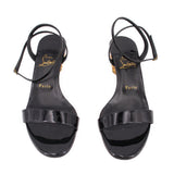 Black patent heeled sandals with wide front strap and slingback ankle strap