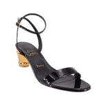 Black patent leather heeled sandals with T-strap and gold high heel