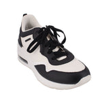 Platform sneakers with black and white upper, black laces, thick white sole