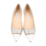 Pair of glitter cap-toe pumps, silver with pointed metallic toe and beige lining
