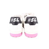 Back view of white and black sneakers with pink sole and #54 heel branding
