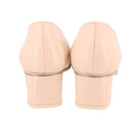 Nude back view heels with covered heel and metal-trimmed runner detail