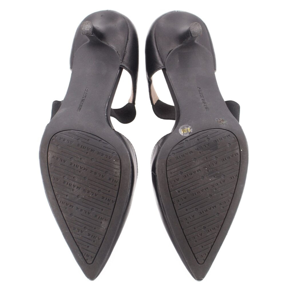 Black kitten heel outsole view with pointed toe and textured heel base