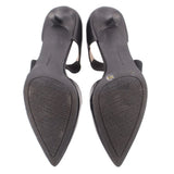 Black kitten heel outsole view with pointed toe and textured heel base