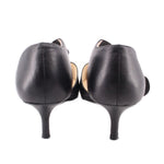 Back view of black kitten heels with slim stiletto heel and closed heel cup