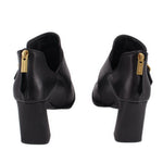 Black leather ankle booties with side buckle and stacked block heel