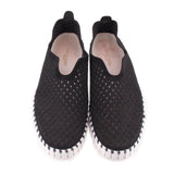 Black cutout flats, pair view, with cushioned lining and perforated upper