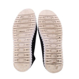 Outsoles of black flats with ribbed tread and size 39 markings