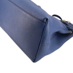 Blue leather GUCCI Soho chain tote bag corner close-up with stitched seam detail.