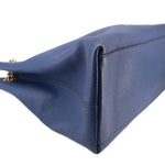 Blue leather GUCCI Soho chain tote bag side close-up with folded-edge stitching.