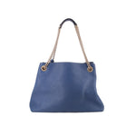 GUCCI Soho chain tote bag in blue leather with gold chain handles and minimal front branding.