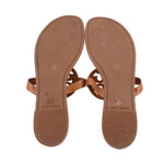 Tan sandals underside view with TORY BURCH logo and textured sole