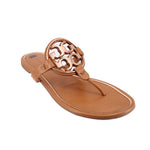 Tan thong sandals with TORY BURCH logo cutout on the strap