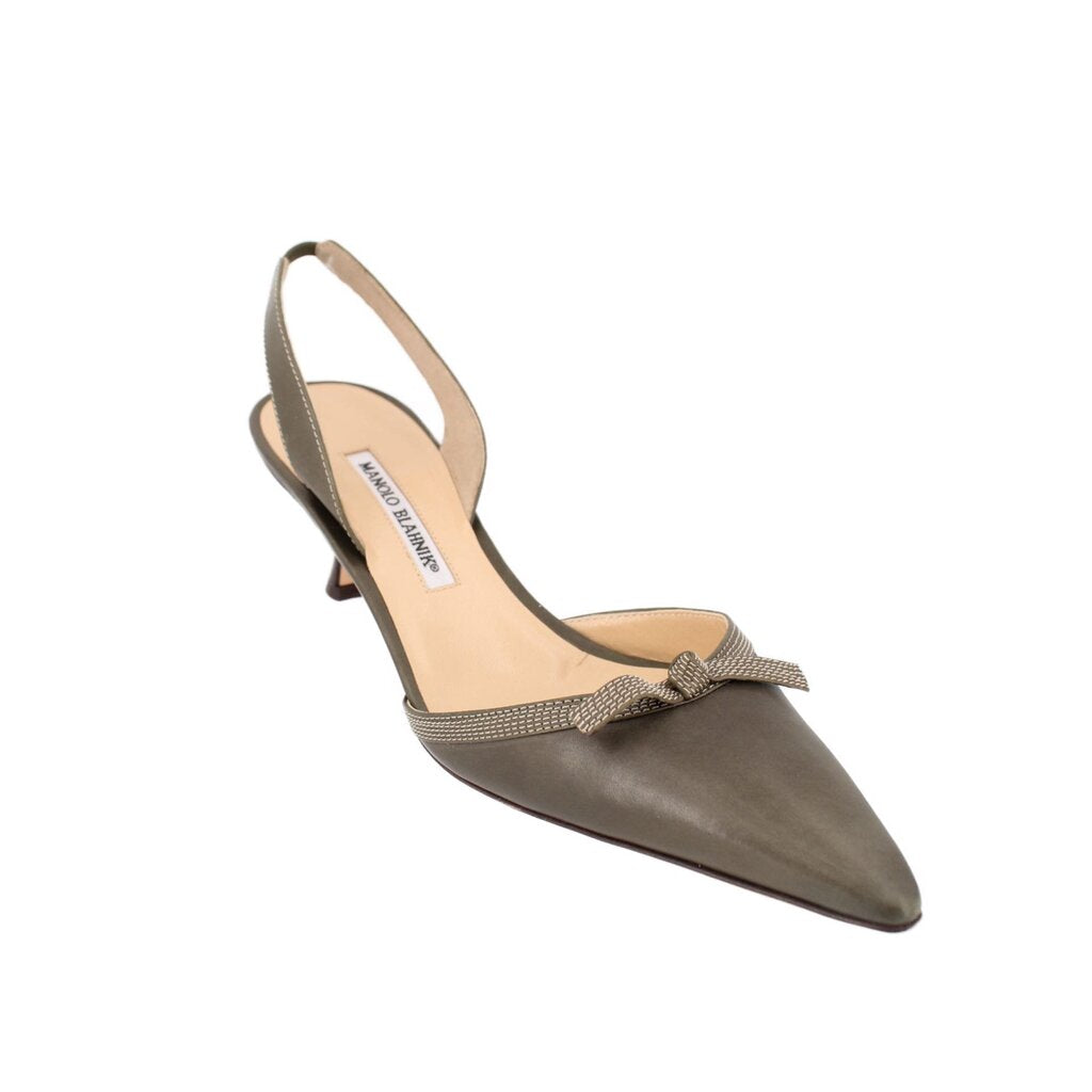 Green leather slingback heels with pointed toe, sling strap, and low kitten heel