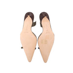 Green leather slingback heels showing insoles and soles with pointed toe shape