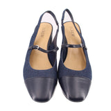 Pair of blue denim slingback heels with black leather toe and ankle strap