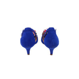 Blue suede heeled sandals from the back with multicolor pom-pom detail