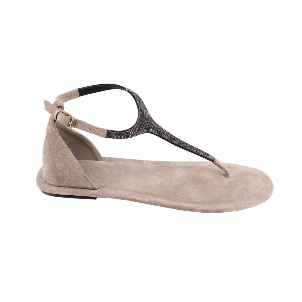 Light gray suede flat sandals with T-strap, ankle strap, and buckle