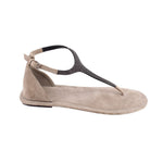 Light gray suede flat sandals with T-strap, ankle strap, and buckle