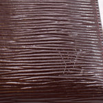 Epi leather texture detail on burgundy zip wallet, fine horizontal grain