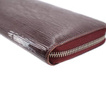 Epi zip wallet close-up, burgundy leather edge and silver zipper teeth