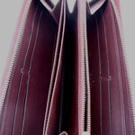 Epi zip wallet interior view with burgundy lining and zip track