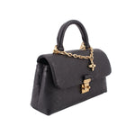 Black monogram flap crossbody bag with top handle, gold chain, and clasp