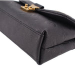 Black monogram mini bag corner seam detail with gold-tone top hardware