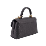 Black monogram mini flap crossbody bag with gold chain detail and structured sides