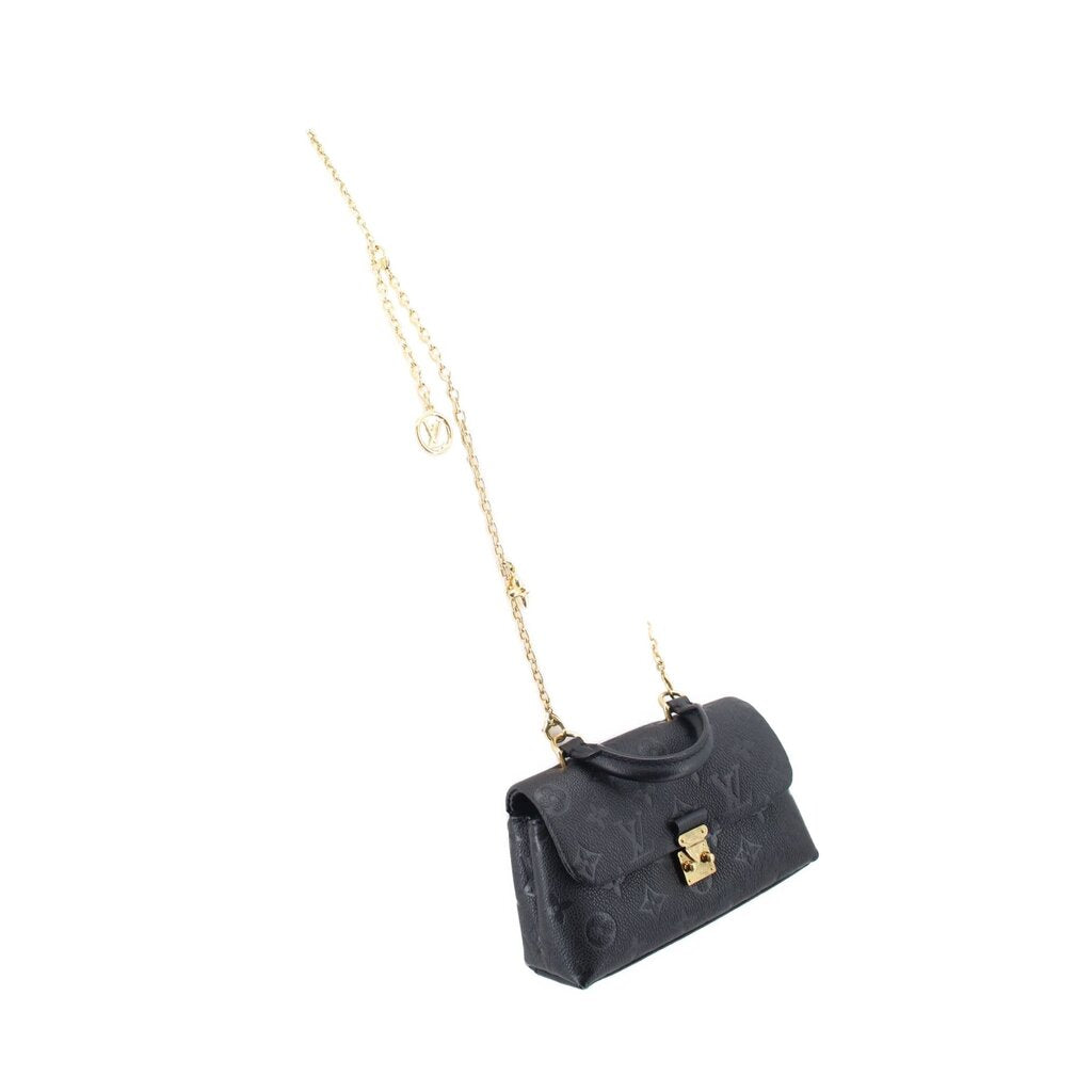 Small black monogram flap crossbody bag with gold chain and charm