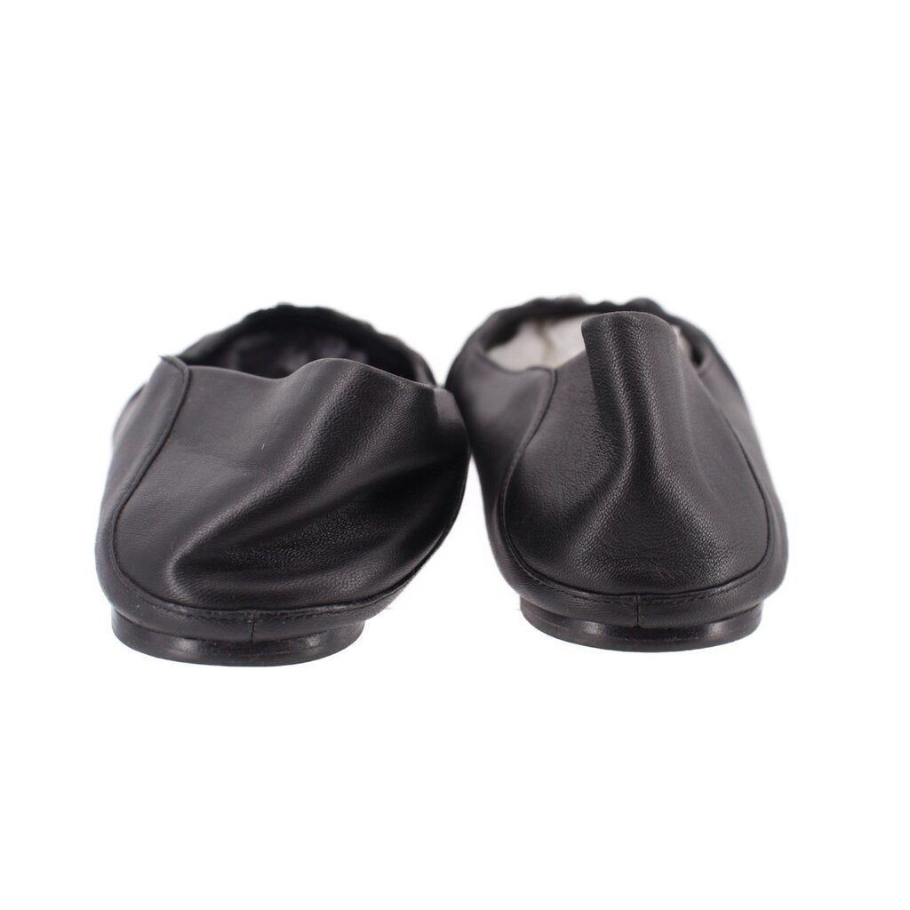 Back view of black leather flats with gathered upper and low sole
