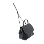Carina crossbody bag angled view in black with strap and top flap detail.