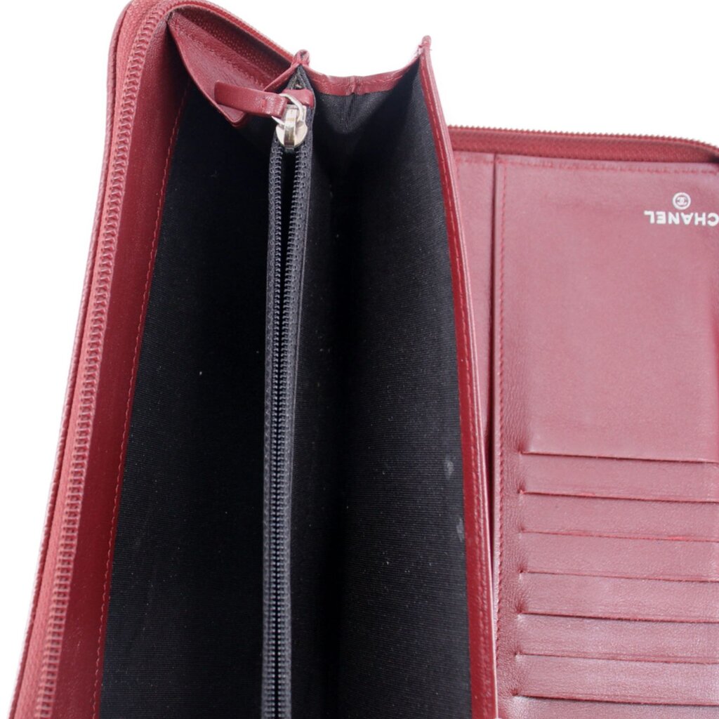 CHANEL red zip-around wallet interior with zip pocket, card slots, and CHANEL label