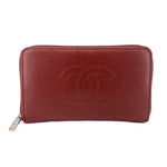 CHANEL red zip-around wallet with debossed CC logo and textured leather