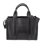 Small black leather tote bag with front center panel and top handles