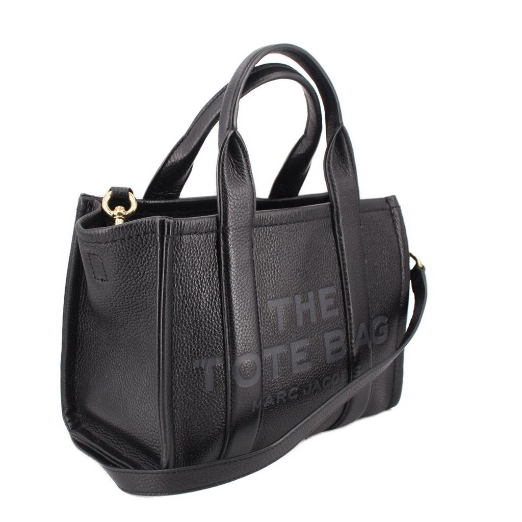 Small black leather tote bag with structured sides and crossbody strap, gold-tone clasp