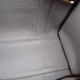 Interior lining detail of black tote bag with stitched seams and textured finish
