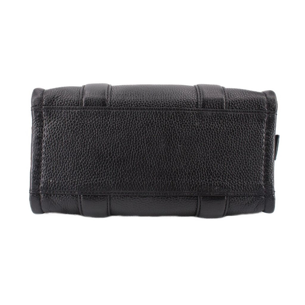 Small black leather tote bag with reinforced top flap and stitched detail