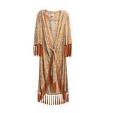 Orange fringe jacket with light floral print, tassel cuffs and hem