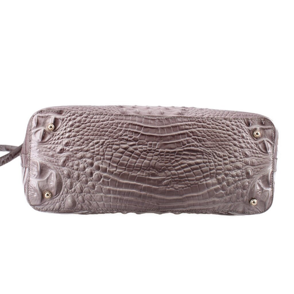Gray croc-embossed satchel base with metal feet and side hardware, back view